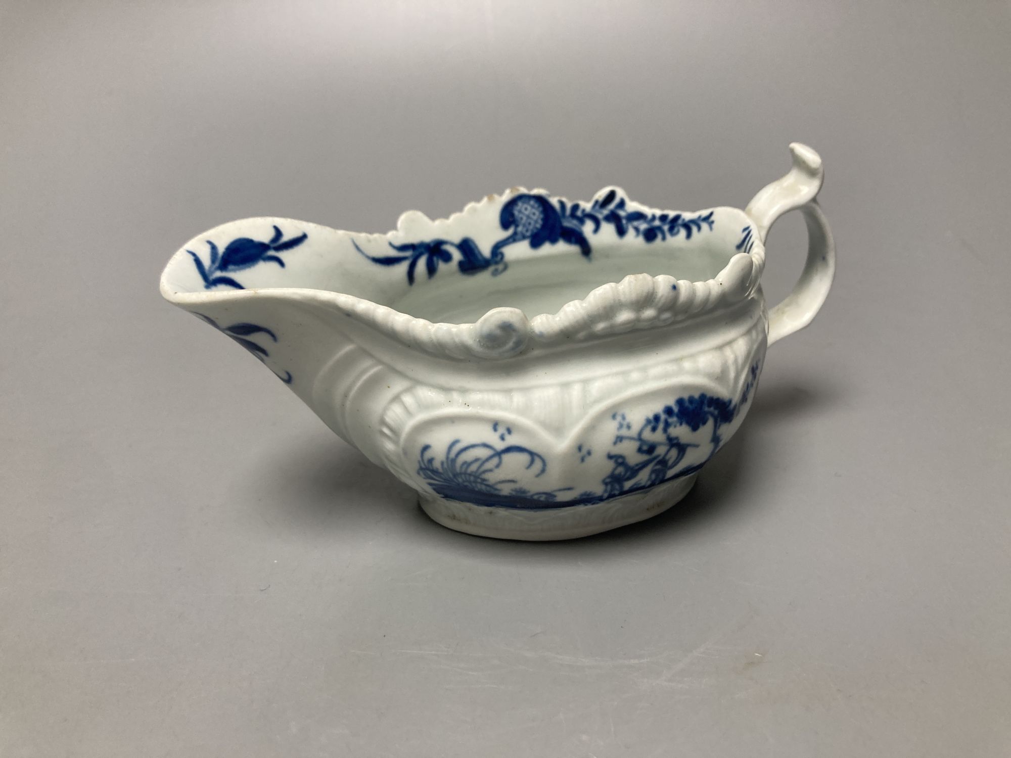 A Worcester Two Porter pattern blue and white small sauceboat circa 1760-5, workman's mark, length 13cm